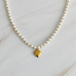 Pearl and gold beaded necklace with polished gold puffy heart charm pendant