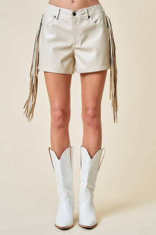 Saints & Hearts Birch beige faux leather fringe shorts styled with white cowboy boots