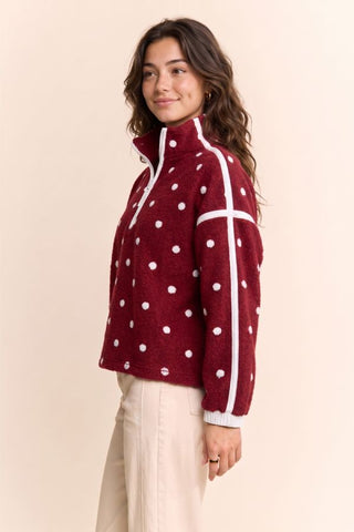 Wine red polka dot fleece half-zip pullover with white stripe detail