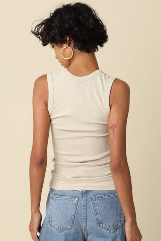 Olivaceous Kelsey Tank Top in cream ribbed fabric, back view, worn with jeans