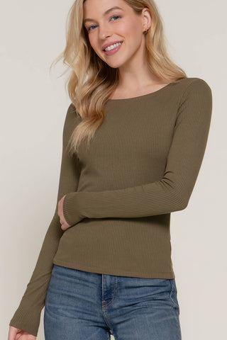 Olive green ribbed long sleeve round neck fitted tee paired with blue jeans