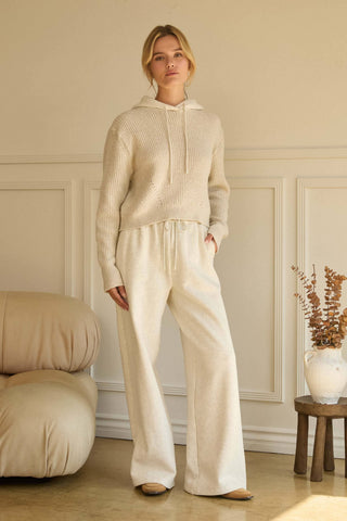 Wide-leg cream soft knit pants with drawstring waist and relaxed fit