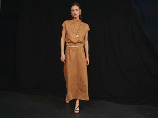 Able Patra tan faux suede mock-neck top and maxi skirt set with gold jewelry