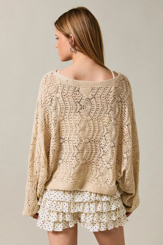 Oatmeal open-weave crochet sweater with circular pattern and long balloon sleeves