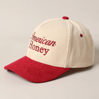 Cream and red corduroy baseball cap with American Honey embroidered text