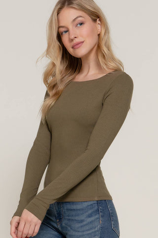 Olive green ribbed long sleeve round neck fitted tee worn with blue jeans