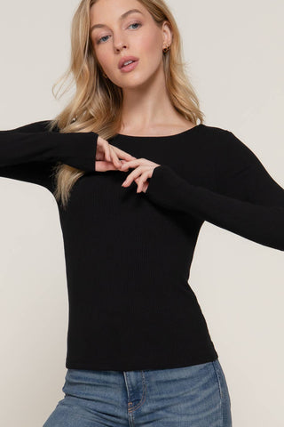 Black ribbed long sleeve round neck fitted tee worn with blue jeans