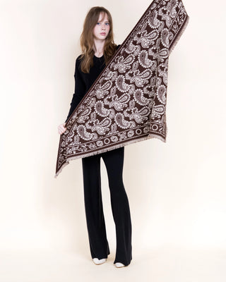 Brown triangular scarf with white paisley print and fringe edges