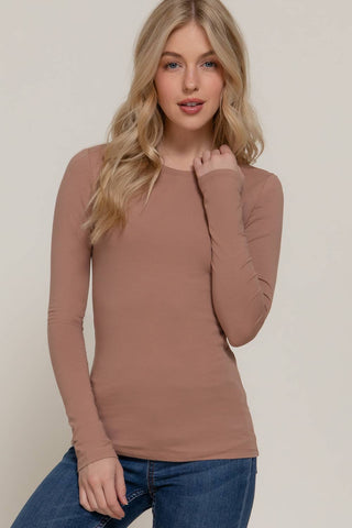 Mauve long sleeve crew neck fitted cotton spandex jersey top on female model