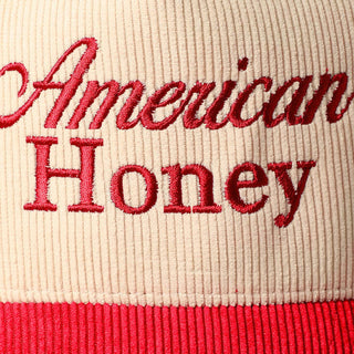 Cream and red corduroy trucker cap with American Honey embroidered text