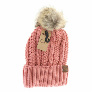 Pink cable-knit CC beanie with faux fur pom and fuzzy lining