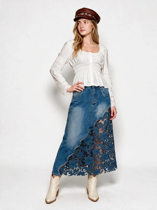 Medium wash denim midi skirt with blue floral lace cutout hem detail