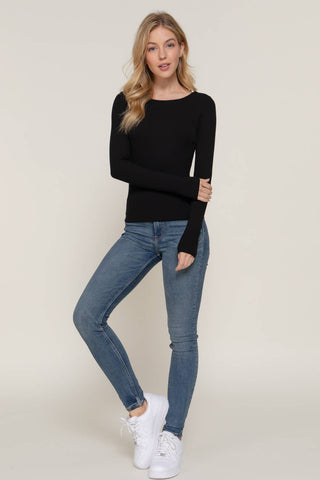 Black long sleeve round neck fitted double layer tee worn with blue skinny jeans