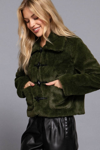 Olive green faux fur duffle jacket with black toggle buttons and front pockets