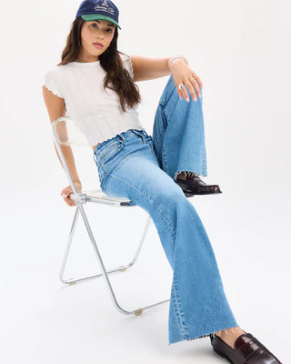 High rise wide leg light wash flare jeans with raw hem details
