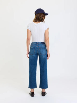 Women's mid-blue cropped straight jeans with back pockets, worn with white tee