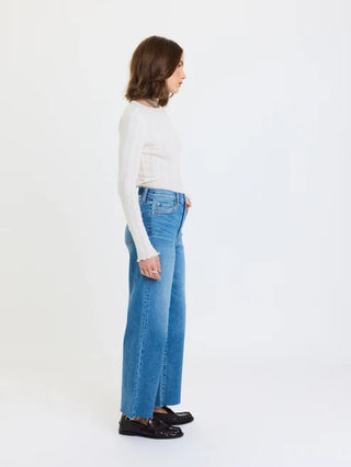 High rise wide ankle jeans in medium blue wash, styled with white top