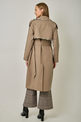 Tan midi trench coat with plaid trim, belt, and storm flap, back view
