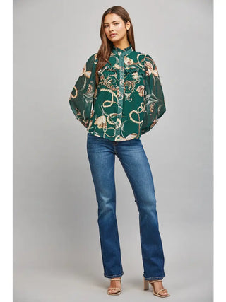 Green floral and chain print chiffon blouse styled with jeans and heels, full-length front view