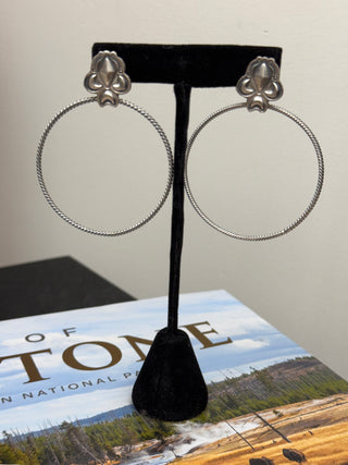 Handmade sterling silver hoop earrings with twisted wire hoops and concho stud tops