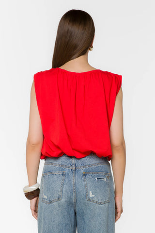 Velvet Heart red sleeveless bubble top with gathered back, paired with distressed jeans