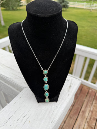 Sterling silver chain necklace with five graduating turquoise stone pendant drops