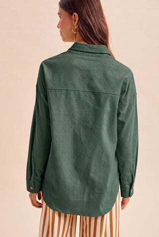 Mallard green corduroy oversized shirt jacket, back view, long sleeves with button cuffs