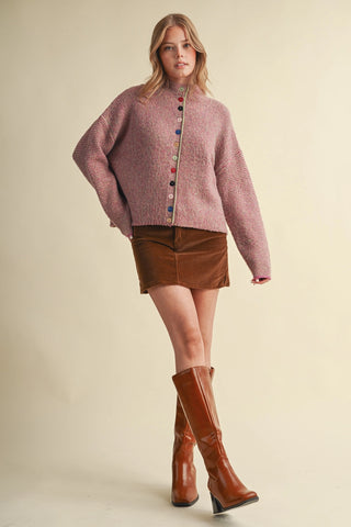 Oversized fuchsia marled knit cardigan with multicolored buttons and mock neck