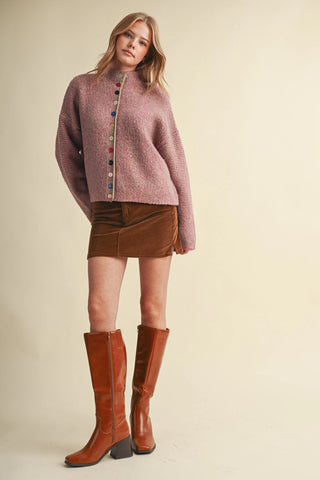 Fuschia marled knit cardigan with colorful mixed buttons and mock neck