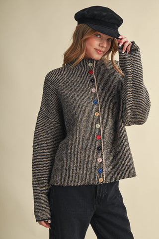 Black and taupe knit cardigan with multicolored buttons and mock neck