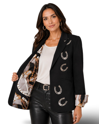 Black blazer with silver horseshoe appliqués and printed equestrian lining, worn open
