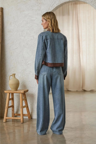 Cropped denim jacket with brown faux suede contrast hem and cuffs, back view