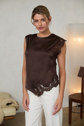 Brown satin sleeveless blouse with dark lace trim along side and hem