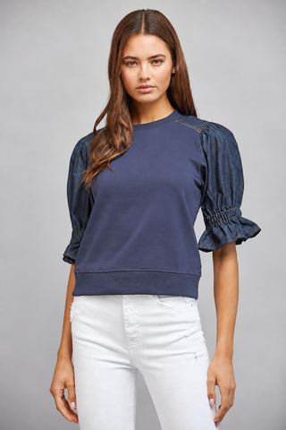 Navy sweatshirt with dark denim puff sleeves and ruffled cuffs, cropped fit