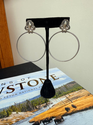Handmade sterling silver hoop earrings with twisted wire hoops and concho stud tops