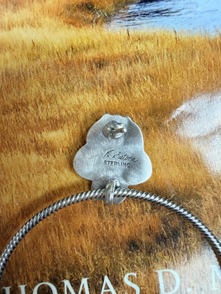 Back of sterling silver earring stamped V. Betone Sterling with snake chain