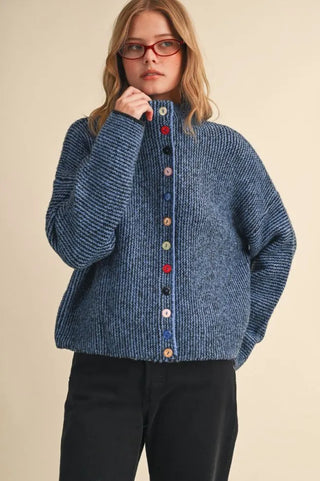 Blue marled knit cardigan with colorful mixed buttons and high neck
