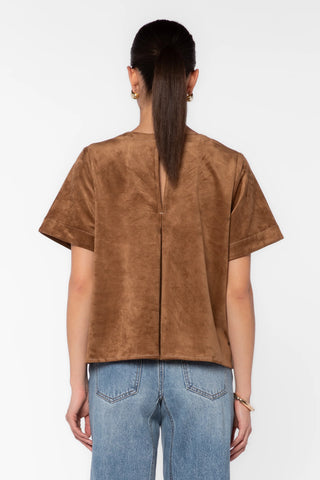 Light tan faux suede short-sleeve top with back seam detail, worn with jeans