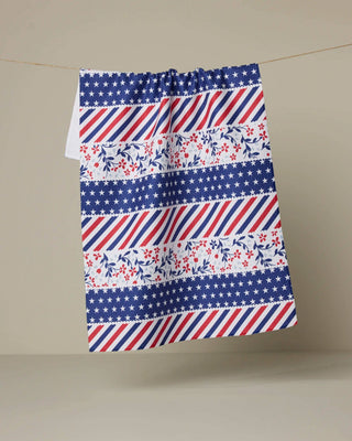 Fabric with red, white, and blue pattern on a beige background