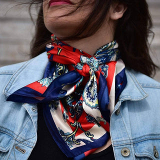Person wearing a colorful scarf with a denim jacket