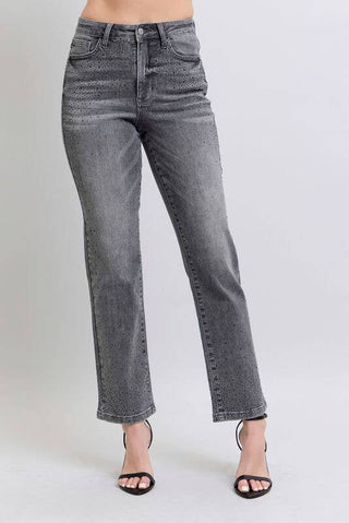 Gray jeans worn by a person on a white background