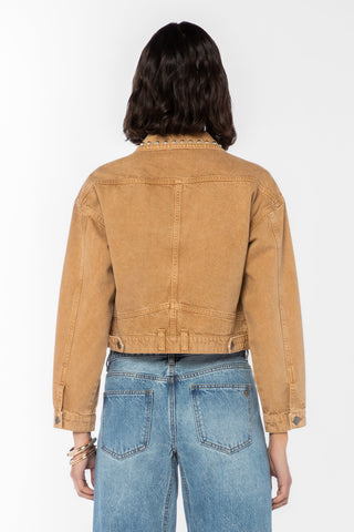 Velvet Heart Shira tan studded collar denim jacket with blue jeans, back view