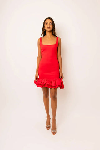 Woman wearing a red dress against a white background