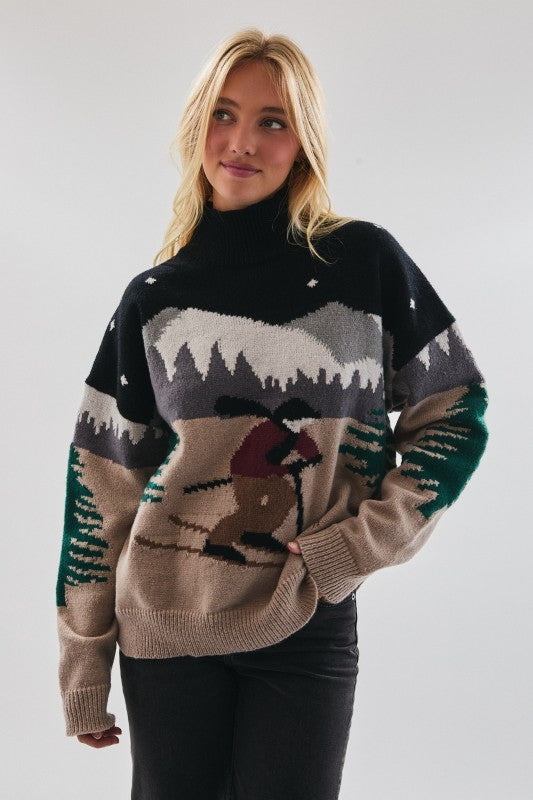 Woman wearing a sweater with a nature-themed design on a plain background
