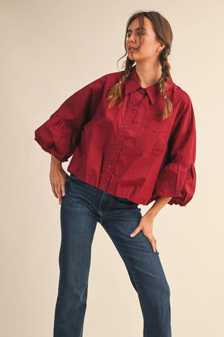 Burgundy cropped button-down shirt with puff sleeves and chest pocket