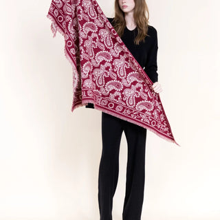 Burgundy paisley triangular scarf with white pattern and fringe edges