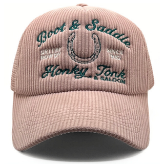 Pink corduroy cap with embroidered text and horse shoe design on a white background