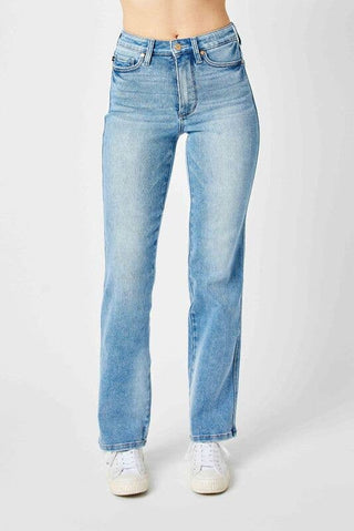 Light blue jeans worn by a person on a white background
