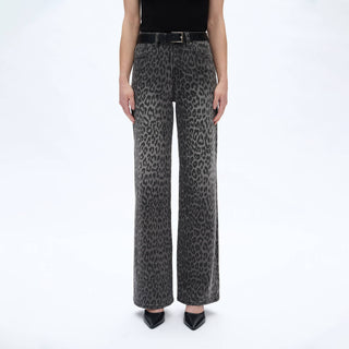 Leopard print jeans worn by a person on a white background