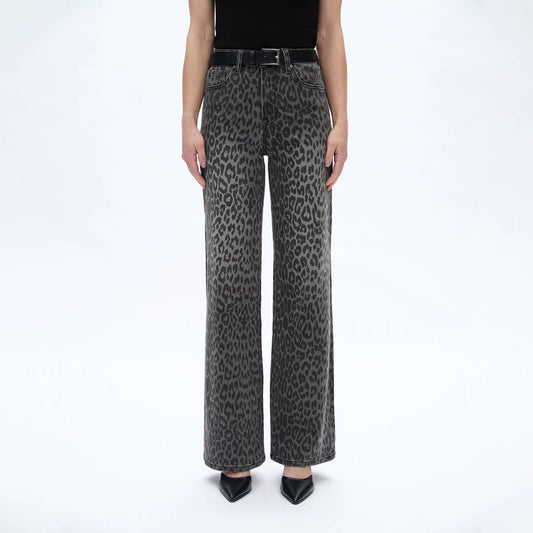 Leopard print jeans worn by a person on a white background